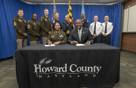 Group shot of memorandum signing with Fort Meade