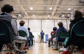 County Executive Calvin Ball speaking to young attendees at an apprenticeship event.
