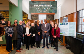 A photo of County Executive posed with members of his new Film Industry and Location Marketing (FILM) Task Force in side the Visit Howard County welcome center.