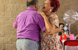 Caucasian couple dancing.