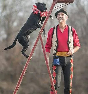 A photo of a person and a dog.