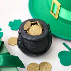 Mini pot of gold, green hat and cut out shamrocks.
