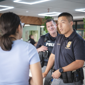 Officers speak with a woman